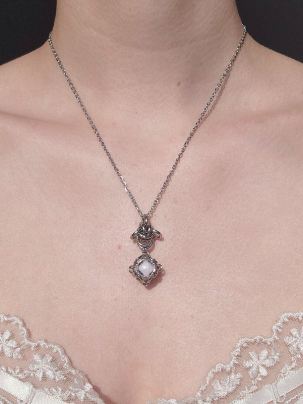 Antique classic style white pearl necklace with a small silver chain